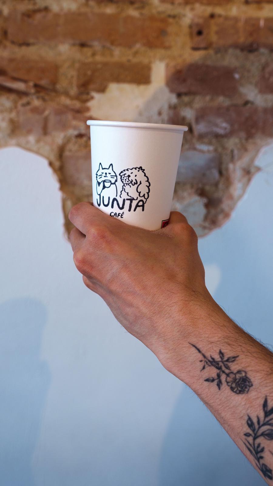 Junta cup against a brick wall